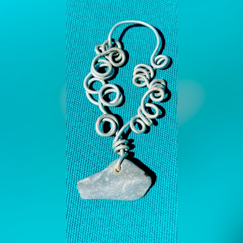Wire wrapped natural finger lakes lucky stone pendant.